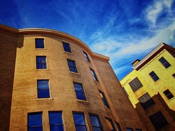 Low angle view of building against blue sky