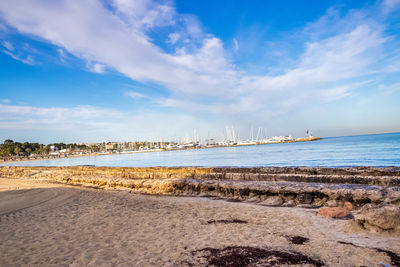 Scenic view of sea against cloudy sky