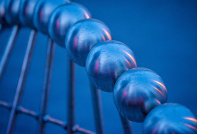 Close-up of blue water on metal