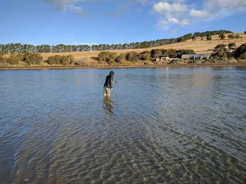 Man standing in a lake