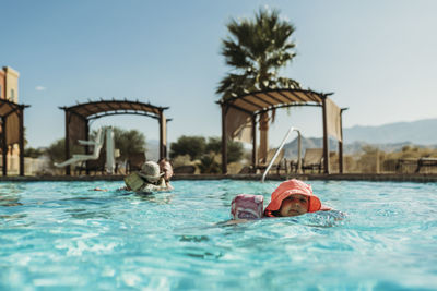 People swimming in pool