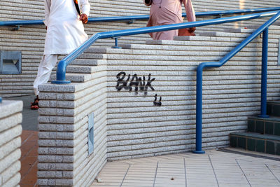 Low section of people standing on staircase