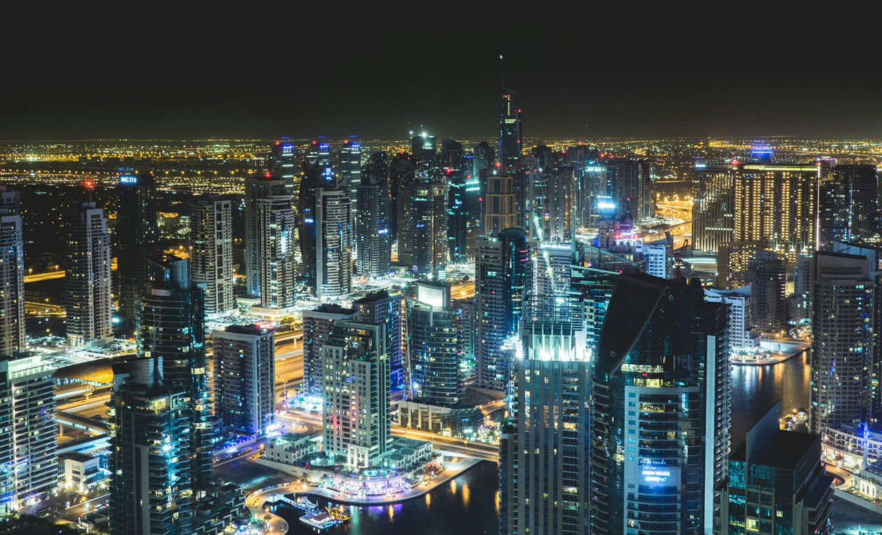 illuminated, night, architecture, skyscraper, cityscape, building exterior, city, high angle view, no people, built structure, travel destinations, modern, outdoors, tall, urban skyline, sky