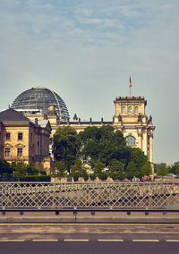 Parliament buildings in city against sky