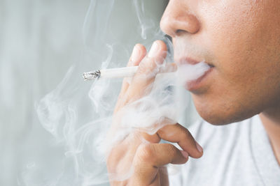 Close-up of man smoking cigarette