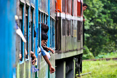 Rear view of people in train