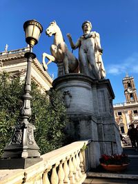 Low angle view of statue against sky