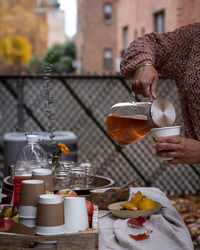 Cropped hand of woman having food