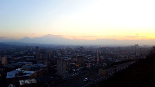 High angle view of city at sunset