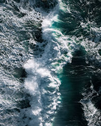 High angle view of water flowing in sea