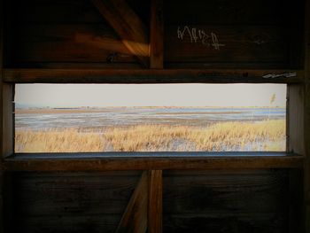 View of wooden posts in sea