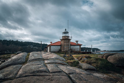 Building on rock against sky