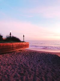 Scenic view of beach against sky during sunset