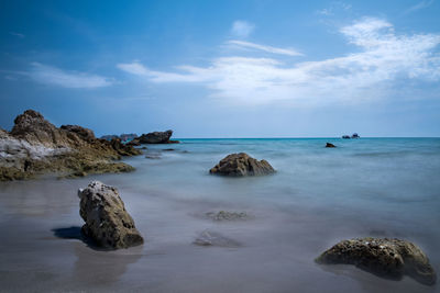 Scenic view of sea against blue sky