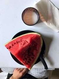 Close-up of hand holding ice cream