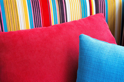 Close-up of cushions on colorful sofa