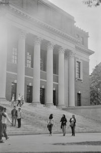 People in front of historic building in winter