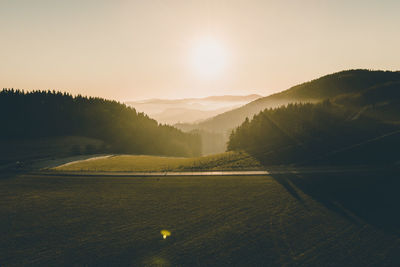 Scenic view of landscape against sky during sunset