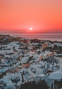 High angle view of oia, santorini. sea against sky during sunset