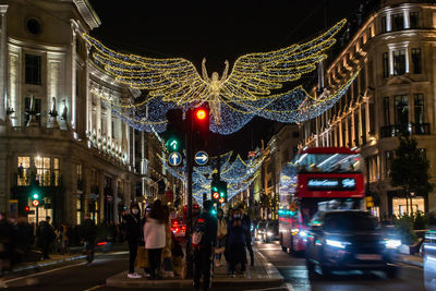 People walking on street at night