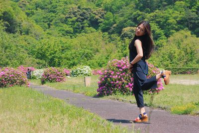 Full length of woman standing on grass