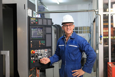 Portrait of man working in factory