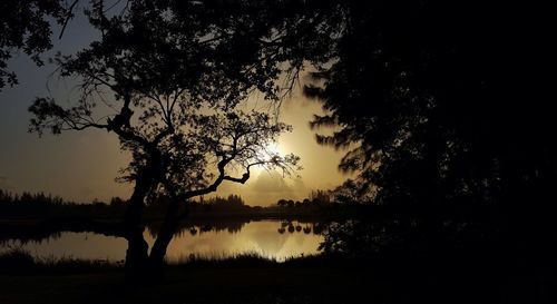 Scenic view of lake at sunset