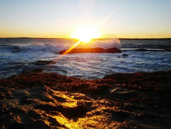 Sun shining over sea