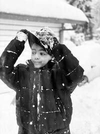 Girl with ice cream standing in snow