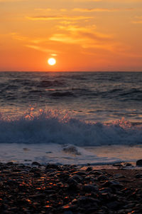 Scenic view of sea against sky during sunset