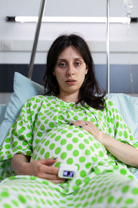 Portrait of pregnant woman resting at hospital