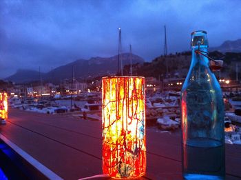 Illuminated lamp post at night