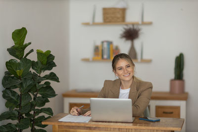 Woman working at home with laptop. home office.  notebook for working. 