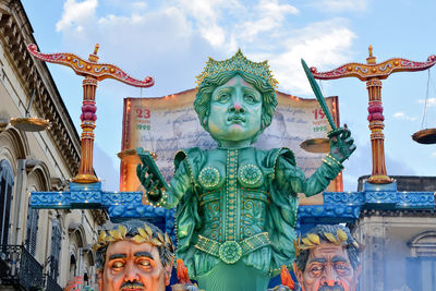 Low angle view of statue against sky