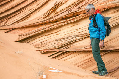 Full length of man walking on sand