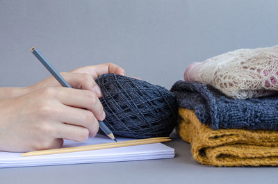 Close-up of hand holding book