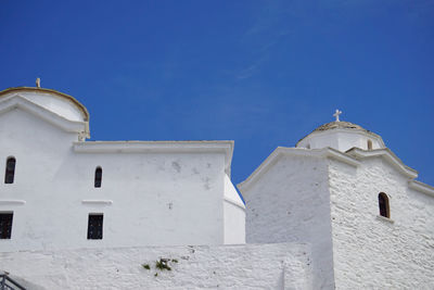 Low angle view of church against clear blue sky