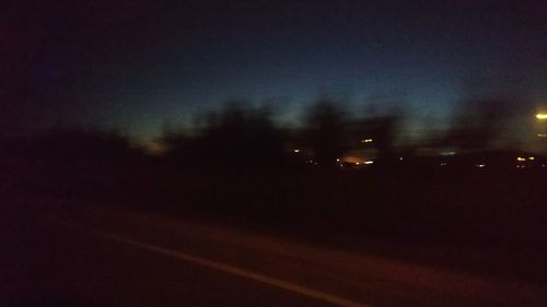 Road against sky at night