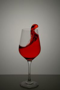 Close-up of red wine against white background