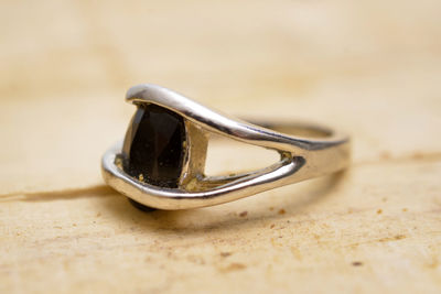 Close-up of wedding rings on table