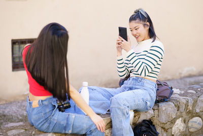 Young woman using mobile phone