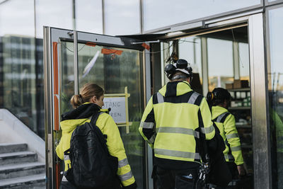 Workers entering construction site