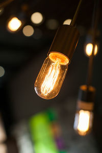 Low angle view of illuminated light bulb