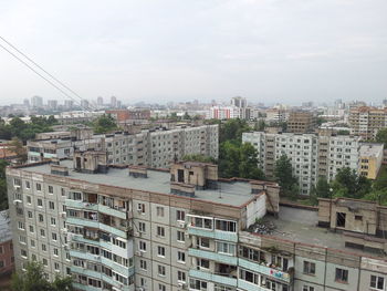 High angle view of buildings in city against sky