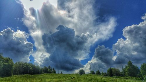 Scenic view of landscape against cloudy sky