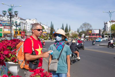 People standing on street in city