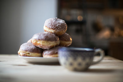 Close-up of donuts in plate on table