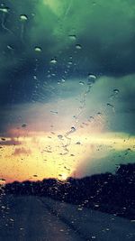 Full frame shot of wet glass window during rainy season