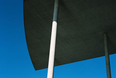 Low angle view of lamp post against blue sky