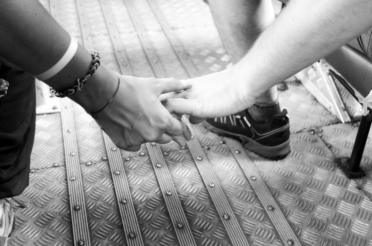 human hand, two people, human body part, togetherness, real people, connection, bonding, day, men, love, women, close-up, outdoors, low section, friendship, young adult, adult, people